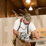 male apprentice working on a carpentry project