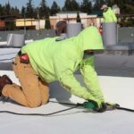roofer apprentice hard at work